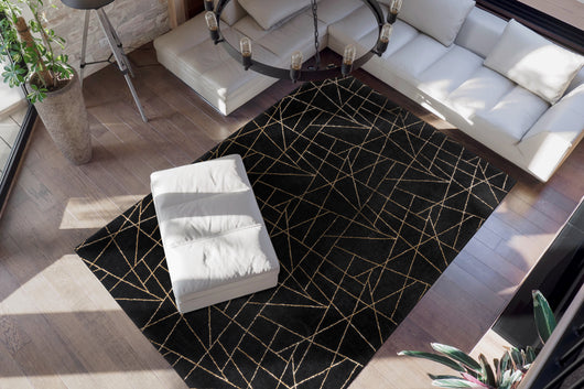 Dieser glamouröse Hochflor Teppich Shaggy in Schwarz/Gold verwandelt Ihr Wohnzimmer in eine luxuriöse Oase.