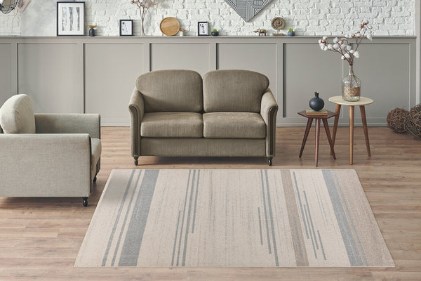Dieser Teppich ist der perfekte Blickfang für jedes Wohnzimmer. Mit seinem modernen nordischen Design und dem grafischen Muster in sanften Creme- und Blautönen fügt er sich harmonisch in Ihre Einrichtung ein. Der Teppich bietet nicht nur eine stilvolle Optik, sondern auch eine weiche, angenehme Oberfläche, die Komfort und Behaglichkeit bringt. Ideal für moderne Wohnräume und vielseitig einsetzbar, z. B. unter dem Esstisch oder im Büro.