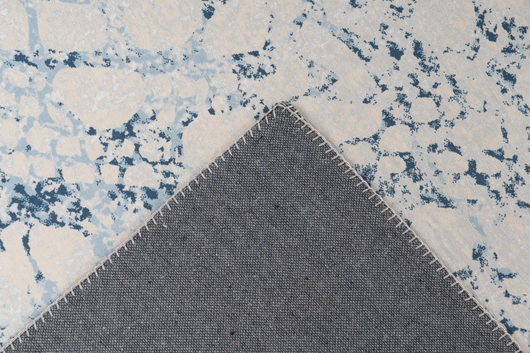 Setzen Sie auf den angesagten Vintage-Look mit diesem Teppich im stilvollen Creme und Blau. Ideal für moderne Wohnräume.