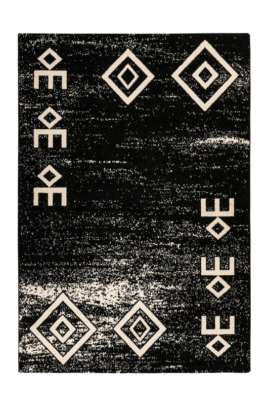 Pflegeleichter Kurzflor-Teppich in Schwarz mit Retro-Muster im modernen Wohnzimmer