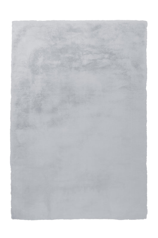 Moderner Raum mit weichem Teppich in Grau/Blau – Ambienteaufnahme