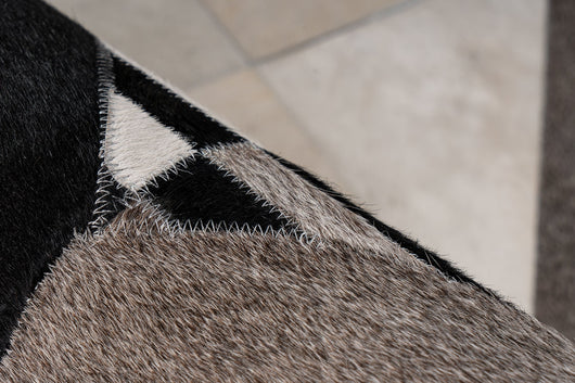 Mit seiner charmanten Erscheinung wird dieser Teppich im Patchwork-Look zum zentralen Element Ihrer Einrichtung.