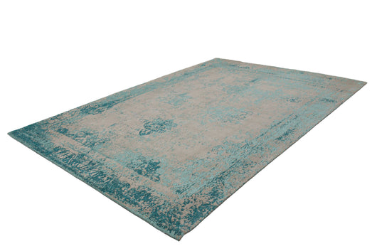 Dieser handgewebte Vintage Teppich Wohnzimmer in Türkis bringt den Charme vergangener Zeiten in Ihr Heim.
