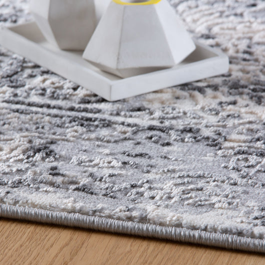 Entdecken Sie die samtige Haptik und das geometrische Design dieses hochwertigen Teppich Grau Kurzflors.